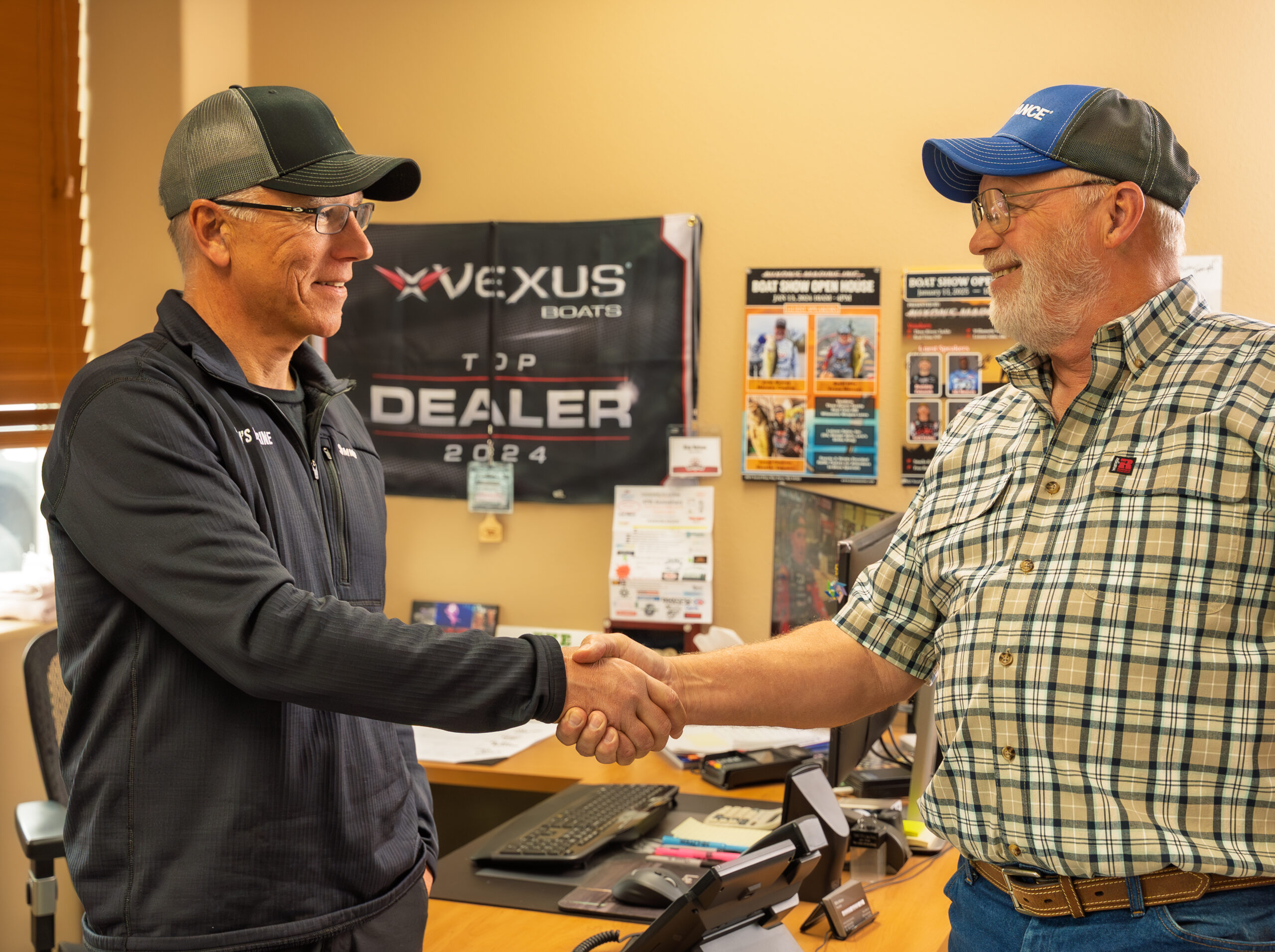 Two men shaking hands in an office