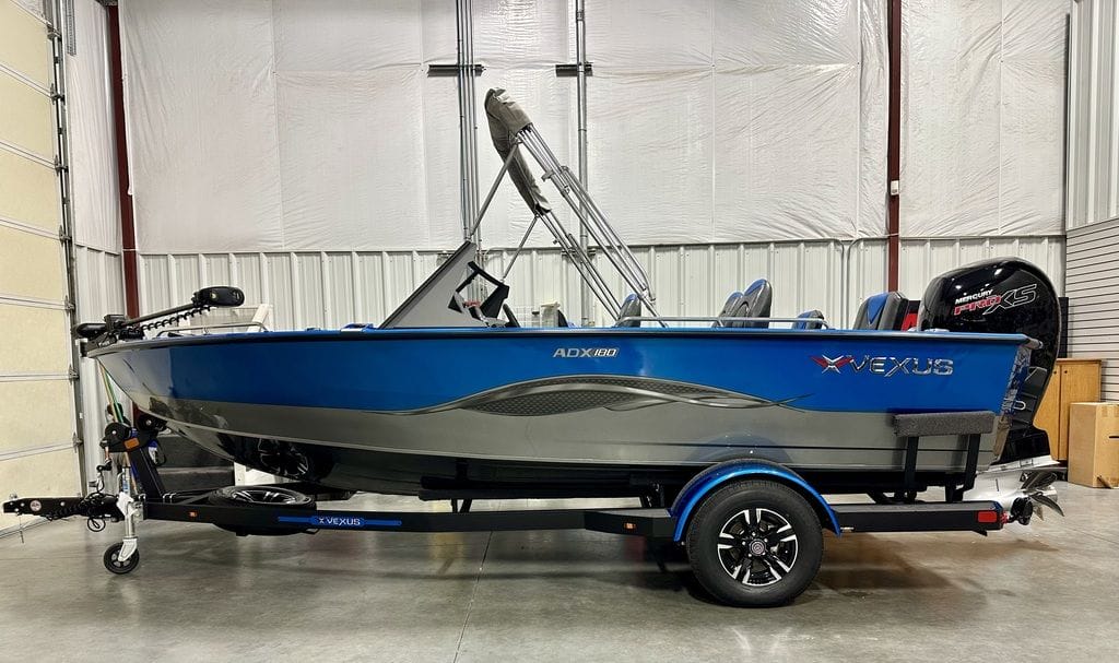 Blue and gray boat in a garage.