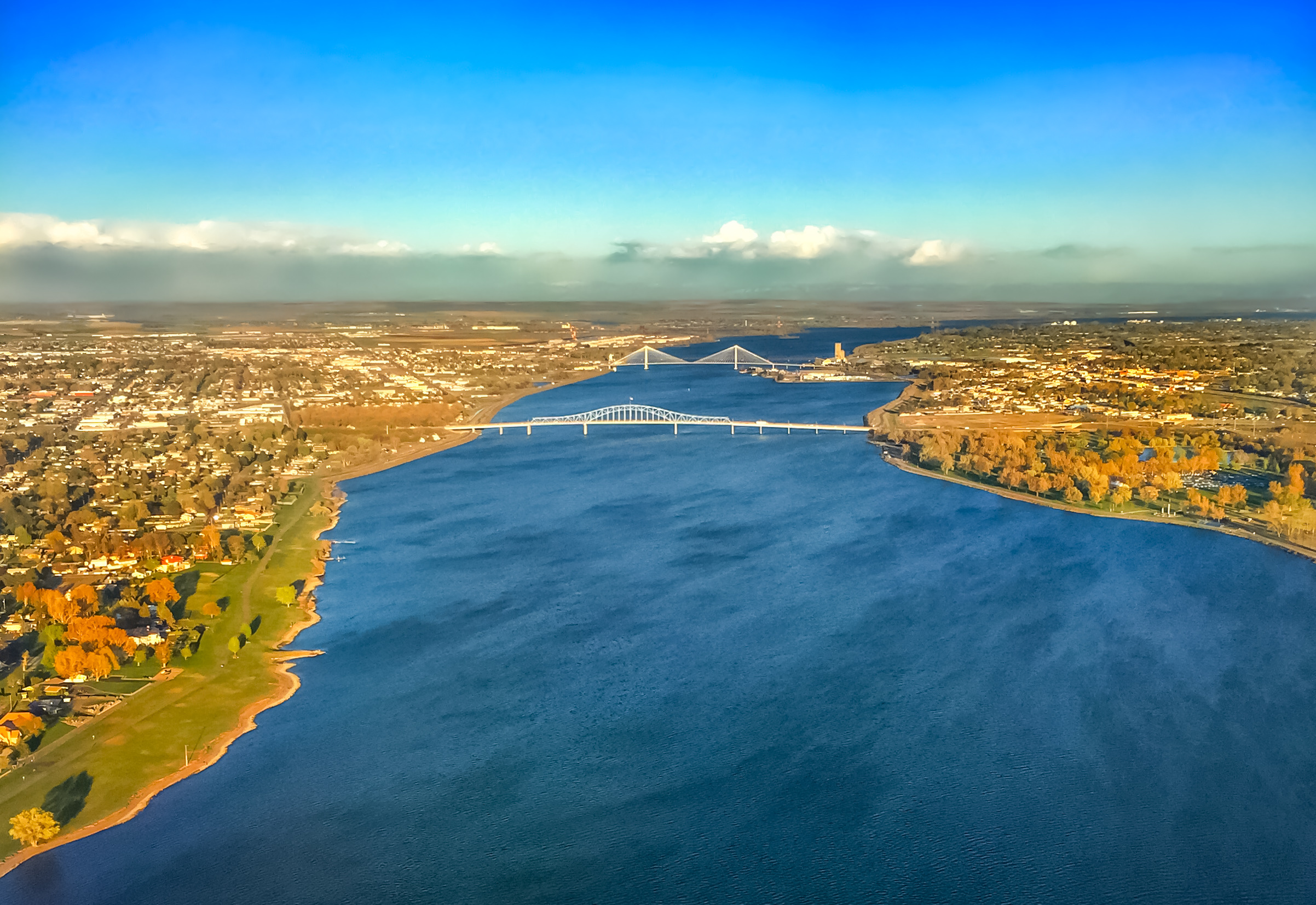 Aerial view of river, bridges, and town