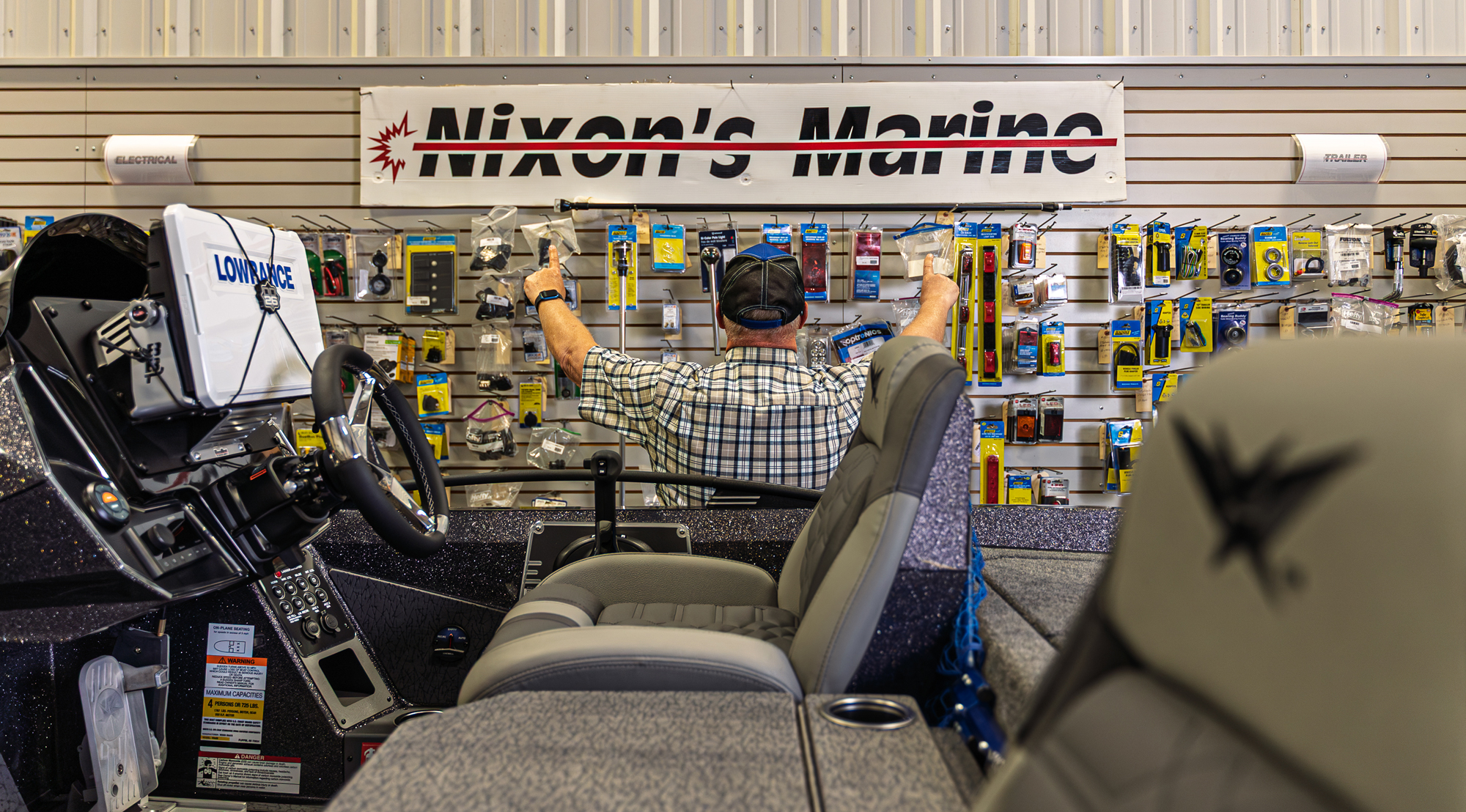 Man shops in marine equipment store.