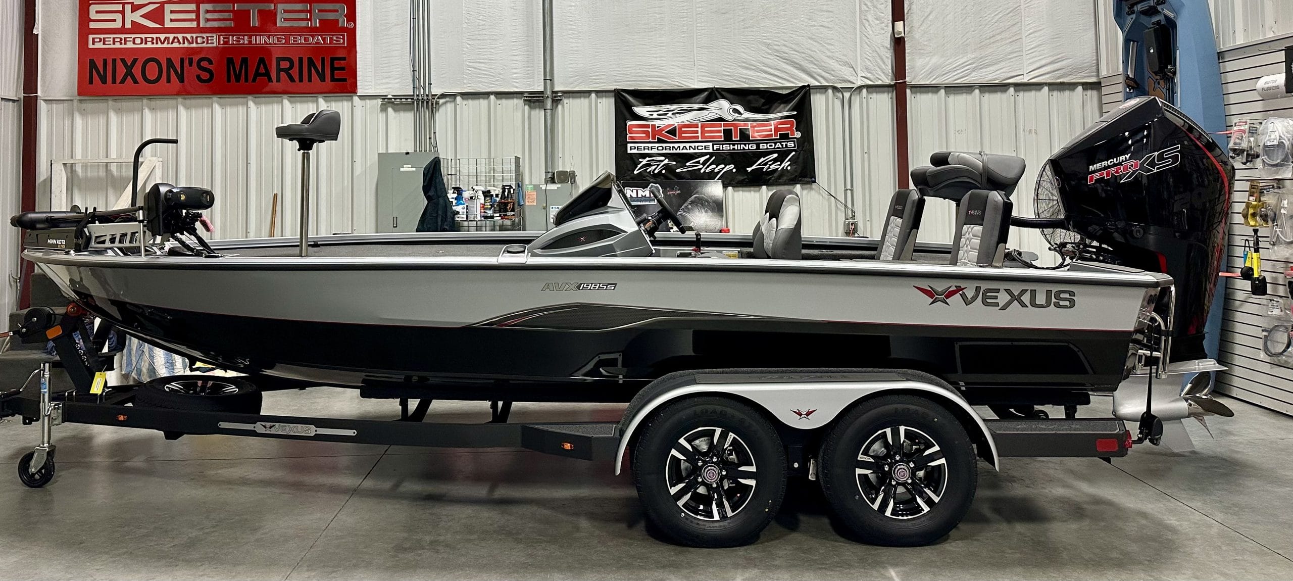 Vexus AVX1985 fishing boat on trailer indoors