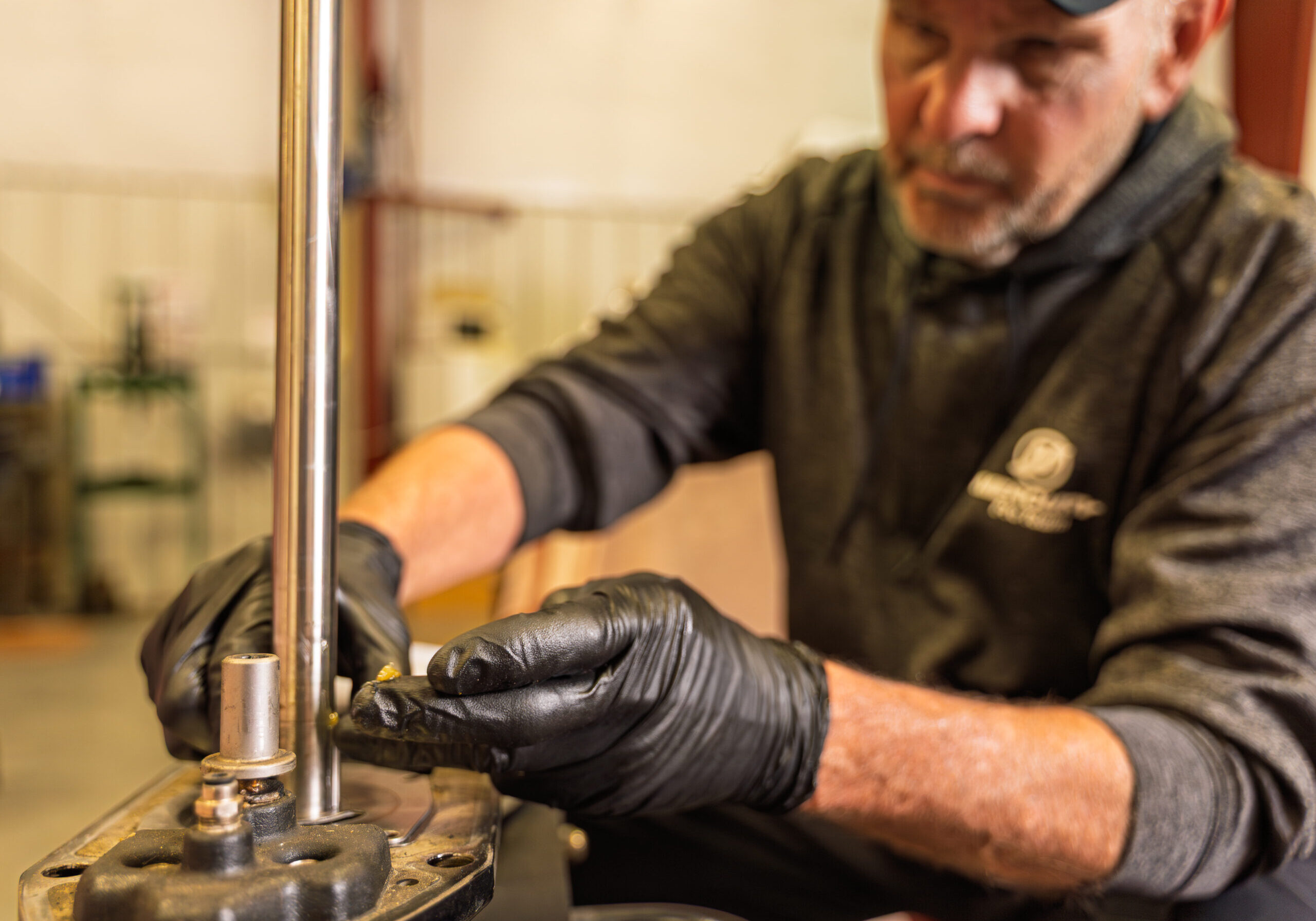 Man working with machinery and tools.